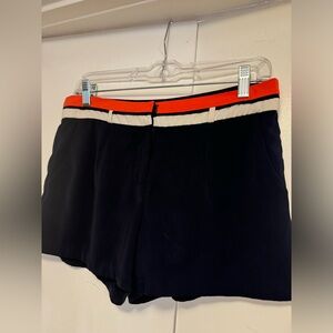 C. Luce women’s shorts, size M, Navy blue with orange & white striped waistband